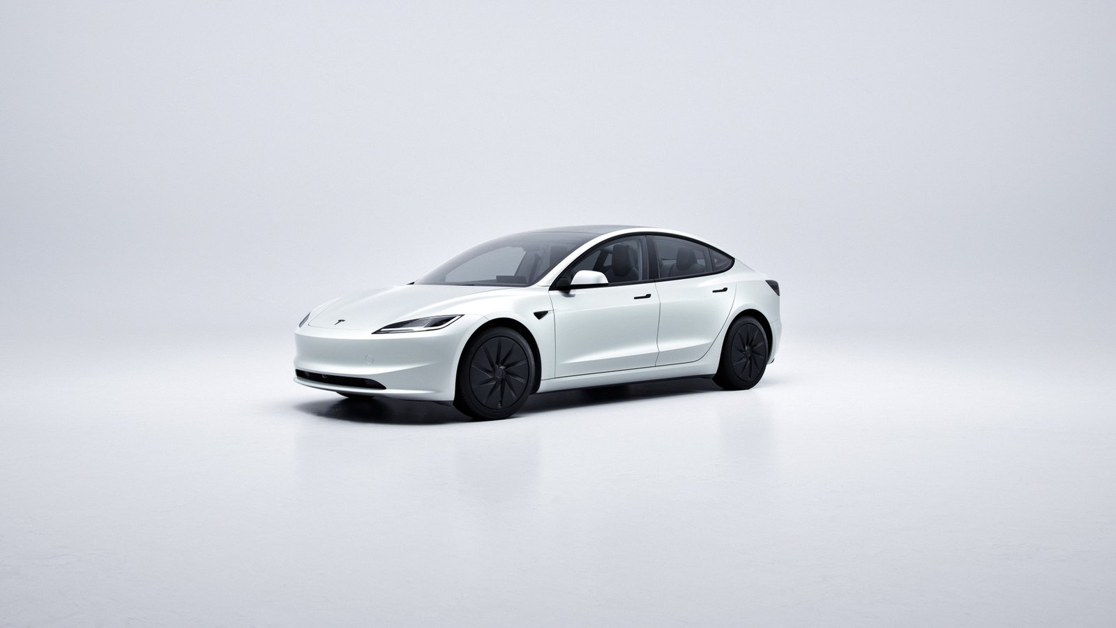 White Tesla Model 3 in a studio